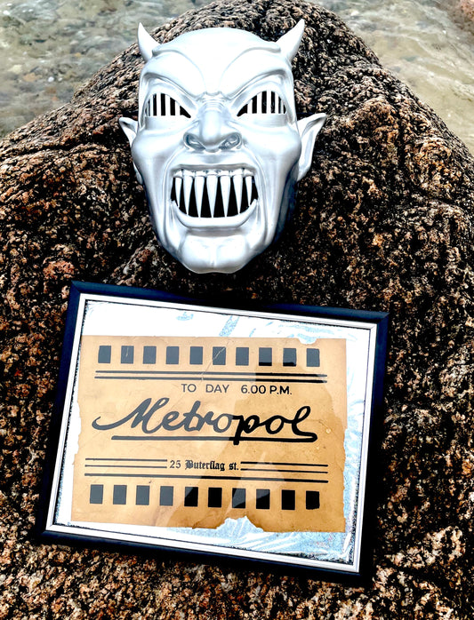 Demons wall mask and movie ticket